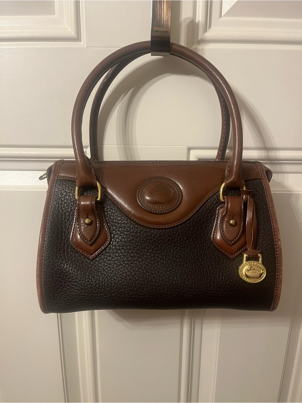 Dooney & Bourke Black Pebble Leather Satchel with Brown Trim